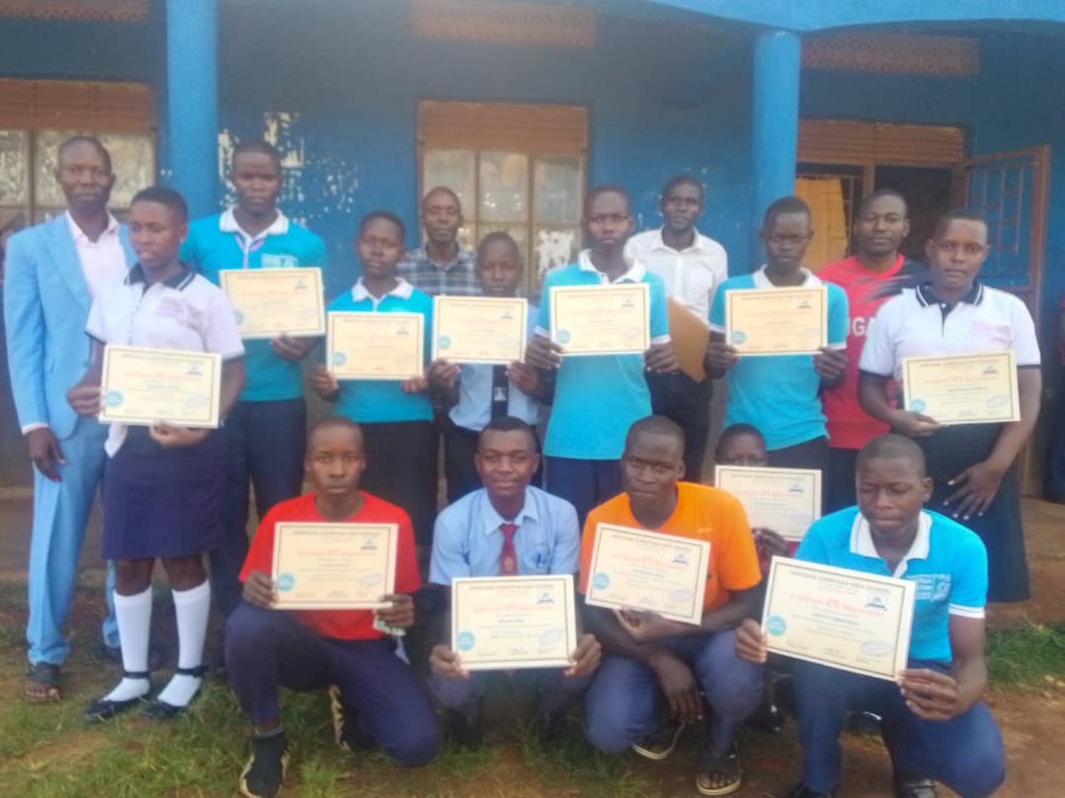 Young people holding certificates